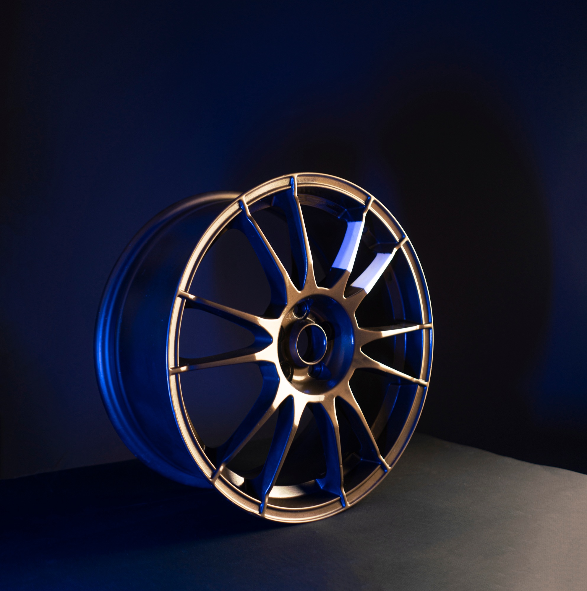 a brand new aluminium car wheel of bronze color isolated